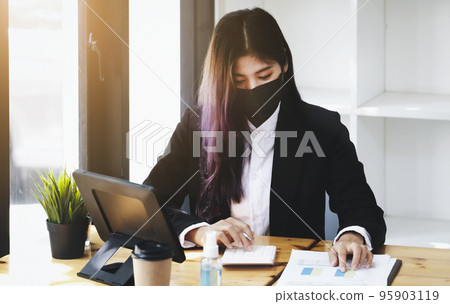Business woman using calculator to review balance sheet annual using document and laptop computer to calculating budget. audit and Check integrity before investment concept Business woman using calculator to review balance sheet annual using document and laptop computer to calculating budget. audit and Check integrity before investment concept 95903119