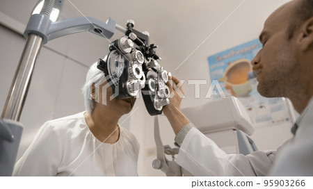 Elderly women have their eyes examined by an ophthalmologist. Elderly women have their eyes examined by an ophthalmologist. 95903266