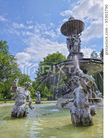 Beautiful fountain in the city park Stadtpark, a green island in the middle of the city center of Graz, Styria region, Austria. Selective focus Beautiful fountain in the city park Stadtpark, a green island in the middle of the city center of Graz, Styria region, Austria. Selective focus 95903790