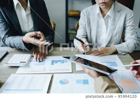 Asian entrepreneurs and business people meeting in a conference room in business planning, financial budget and investment risk assessment to analyze customer groups to increase company growth. Asian entrepreneurs and business people meeting in a conference room in business planning, financial budget and investment risk assessment to analyze customer groups to increase company growth. 95904120