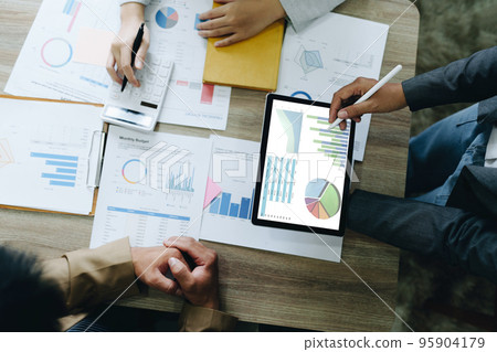 Asian entrepreneurs and business people meeting in a conference room in business planning, financial budget and investment risk assessment to analyze customer groups to increase company growth. Asian entrepreneurs and business people meeting in a conference room in business planning, financial budget and investment risk assessment to analyze customer groups to increase company growth. 95904179