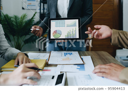Asian entrepreneurs and business people meeting in a conference room in business planning, financial budget and investment risk assessment to analyze customer groups to increase company growth. Asian entrepreneurs and business people meeting in a conference room in business planning, financial budget and investment risk assessment to analyze customer groups to increase company growth. 95904413