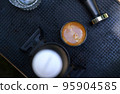Beautiful crema coffee in a glass. 95904585