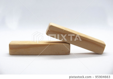 Two wooden blocks on white cover background with customizable space for text or ideas. Copy space Two wooden blocks on white cover background with customizable space for text or ideas. Copy space 95904663