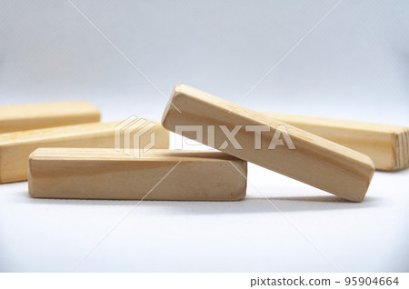 Wooden blocks on white cover background with customizable space for text or ideas. Copy space 95904664