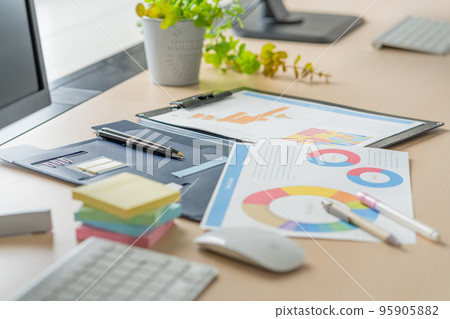 Business items spread out on the office desk Business items spread out on the office desk 95905882