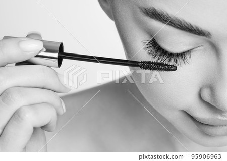 Beautiful woman with long false eyelashes 95906963