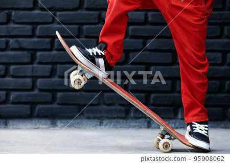 Young skater with skateboard have fun at children training class 95908062