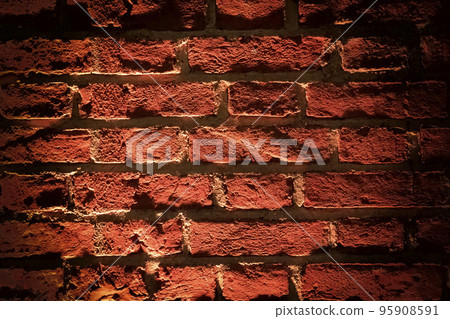 Red brick wall texture grunge background with vignetted corners. Grunge weathered stone texture. Red brick wall texture grunge background with vignetted corners. Grunge weathered stone texture. 95908591