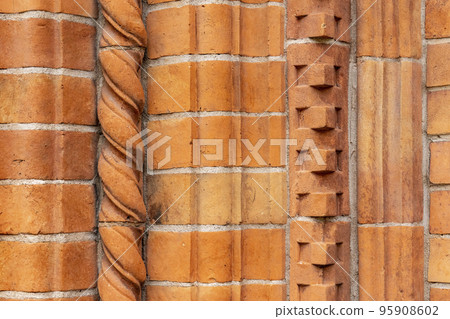 Brick work wall with ornament on old building. Red brick wall texture architecture background. Brick work wall with ornament on old building. Red brick wall texture architecture background. 95908602