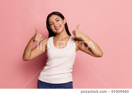 I am ok. Happy woman, sign ok, smiling, isolated on trendy pink studio background. Beautiful female half-length portrait. Emotional woman. Human emotions, facial expression concept I am ok. Happy woman, sign ok, smiling, isolated on trendy pink studio background. Beautiful female half-length portrait. Emotional woman. Human emotions, facial expression concept 95909460