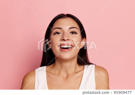 Surprise. Winning success happy woman celebrating being a winner. Image of caucasian female model on pink studio background. Victory, delight concept. Human facial emotions concept. Surprise. Winning success happy woman celebrating being a winner. Image of caucasian female model on pink studio background. Victory, delight concept. Human facial emotions concept. 95909477