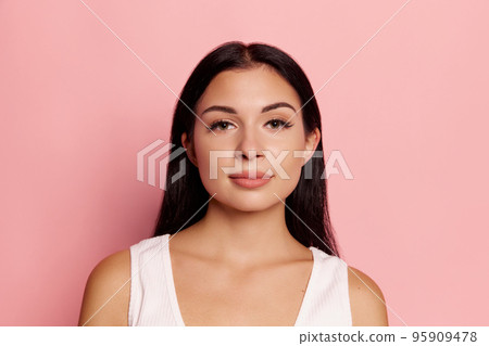 I am ok. Happy smiling woman isolated on trendy pink studio background. Beautiful female half-length portrait. Emotional woman. Human emotions, facial expression concept 95909478