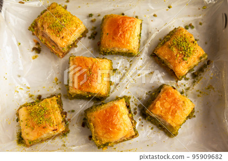 Baklava with pistachio, one of the most beautiful desserts of Turkish cuisine, Turkish baklava in the package 95909682