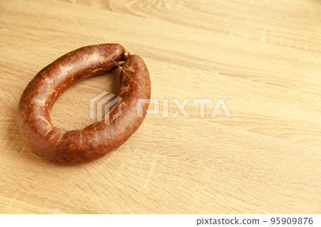 Kangal sucuk made from various spice mixtures used in Turkish cuisine, on oak cutting board 95909876
