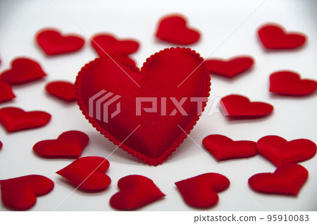 Big heart shape surrounded with other small heart shape on white cover background. With customizable space for text and ideas. 95910083