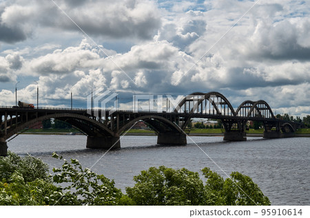 City bridge across the river with metal arches City bridge across the river with metal arches 95910614