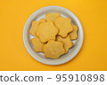 butter cookies isolated on light brown plate 95910898