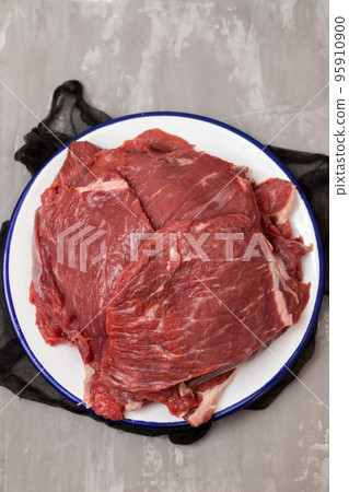 Fresh raw beef steak on white dish Fresh raw beef steak on white dish 95910900