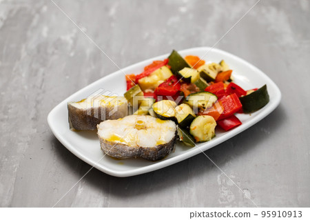 baked vegetables with boiled fish on white plate baked vegetables with boiled fish on white plate 95910913