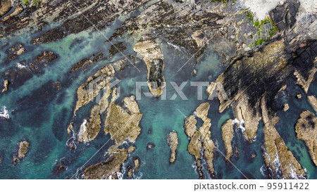 strange rocks on the coastland. Top view of the rocks of the Celtic Sea. strange rocks on the coastland. Top view of the rocks of the Celtic Sea. 95911422
