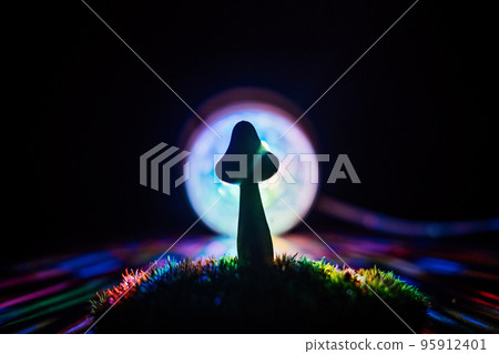 Psilocybin therapy as treatment of mental health challenges. psilocybin psychotropic magic psilocybin mushrooms on dark neon background Psilocybin therapy as treatment of mental health challenges. psilocybin psychotropic magic psilocybin mushrooms on dark neon background 95912401
