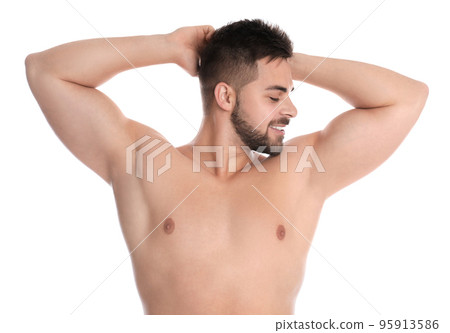 Young man showing hairless armpits after epilation procedure on white background Young man showing hairless armpits after epilation procedure on white background 95913586