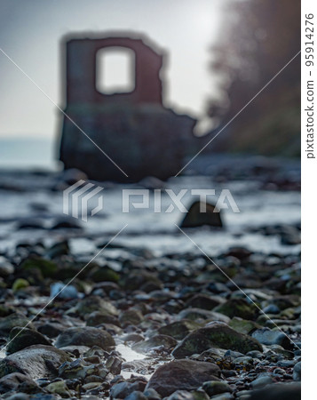 Ruins of the old gauge tower on shore bellow Cape Arkona cliff Ruins of the old gauge tower on shore bellow Cape Arkona cliff 95914276