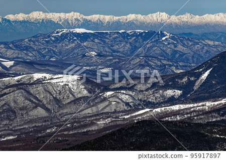 Northern Alps, Tateyama Tsurugi and Ushiro Tateyama mountains seen from Yatsugatake mountain range and Mt. Nishitengudake in winter 95917897