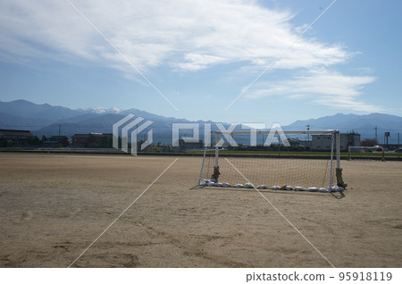 Goal post and Mt. Shirouma in the Northern Alps on the ground in Nyuzen Town, Toyama Prefecture Goal post and Mt. Shirouma in the Northern Alps on the ground in Nyuzen Town, Toyama Prefecture 95918119