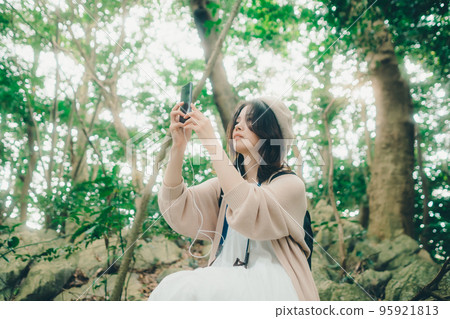 Photo of a woman standing in nature 95921813