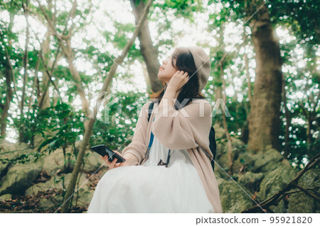 Photo of a woman standing in nature Photo of a woman standing in nature 95921820