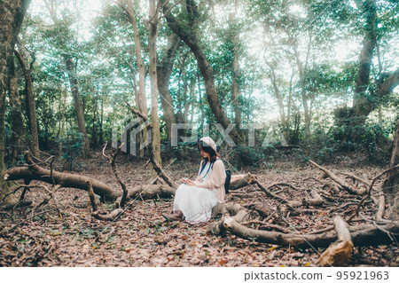 Photo of a woman standing in nature 95921963