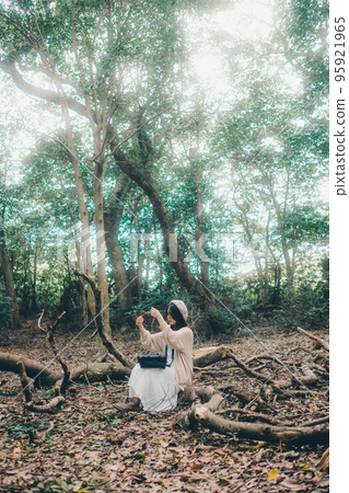 Photo of a woman standing in nature Photo of a woman standing in nature 95921965