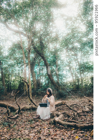 Photo of a woman standing in nature Photo of a woman standing in nature 95921966
