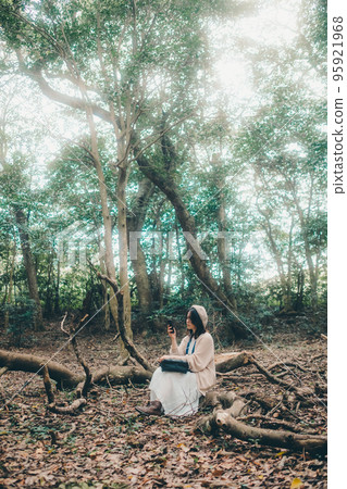 Photo of a woman standing in nature 95921968