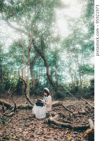Photo of a woman standing in nature Photo of a woman standing in nature 95921973
