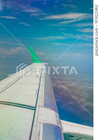 The view from the plane Blue sky, white clouds and wings The view from the plane Blue sky, white clouds and wings 95922462