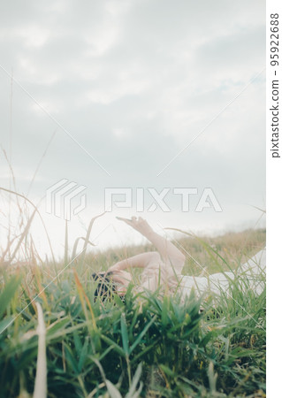 Photo of a woman standing in nature 95922688