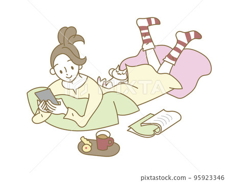 Young woman relaxing looking at her smartphone Young woman relaxing looking at her smartphone 95923346