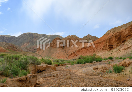 Red canyon Konorchek (Suluu-Terek) in the mountains in Kyrgyzstan 95925032