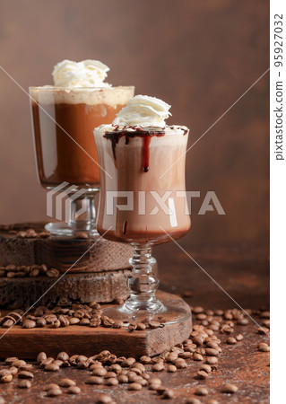 Coffee and chocolate drinks with whipped cream. 95927032
