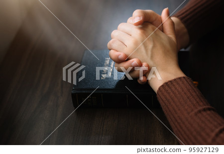 woman hands praying to god with the bible. Woman Pray for god blessing. Religious beliefs Christian life crisis prayer to god. 95927129