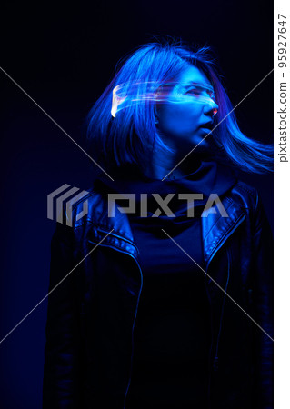 Woman is using augmented reality headset. Concept of virtual, augmented and extended reality. 95927647