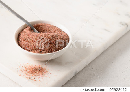 Indian Black salt, Kala namak in white bowl. Indian cuisine. Indian Black salt, Kala namak in white bowl. Indian cuisine. 95928412