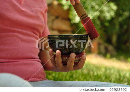 little girl with a Tibetan bowl 95928592