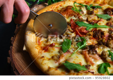 delicious hot pizza on the board 95928602