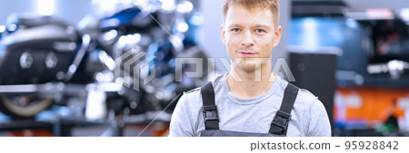 Smiling mechanic, maintenance service worker in uniform, man with clipboard paper 95928842