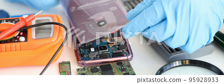 Technician repairing mobile phone, electronic smartphone technology 95928933