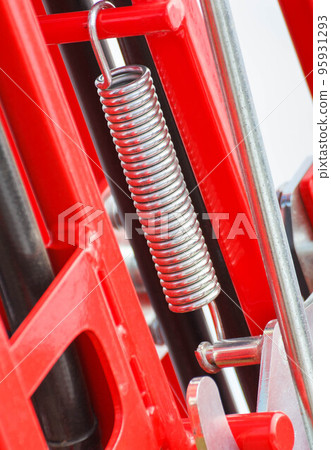 Hard spring made of steel. Part and detail of industrial or agricultural machine Hard spring made of steel. Part and detail of industrial or agricultural machine 95931293